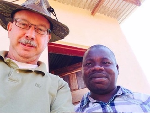 Don with a pastor on the field